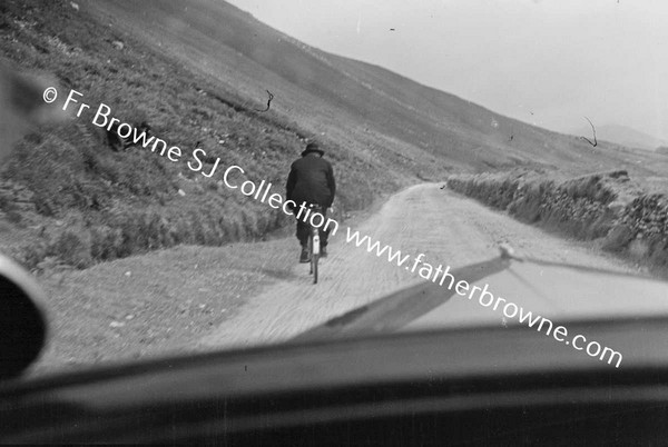 REV MC GRATH RIDING IN STORM. FROM MOTOR CAR